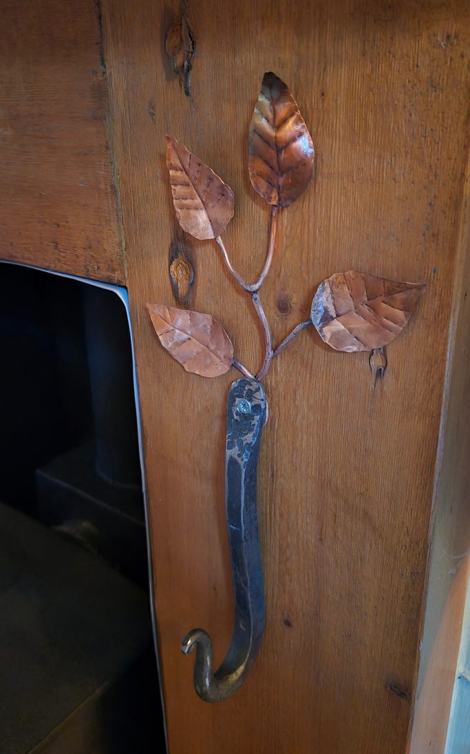 Hand forged hook with copper leaves