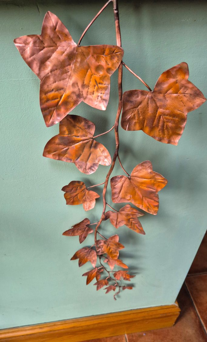Wall-hanging copper ivy leaves.