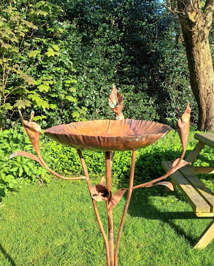 Birdbath with flowers