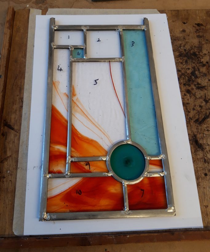 First stained glass window